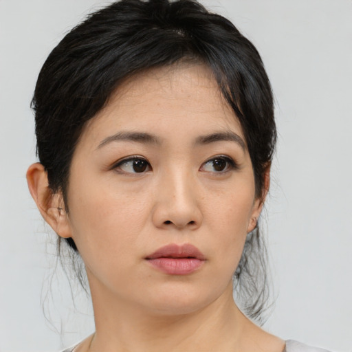 Neutral asian young-adult female with medium  black hair and brown eyes