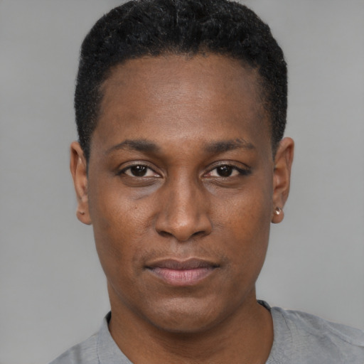 Joyful black young-adult male with short  black hair and brown eyes