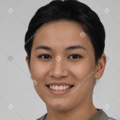 Joyful asian young-adult female with short  black hair and brown eyes