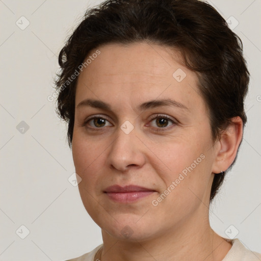 Joyful white young-adult female with short  brown hair and green eyes