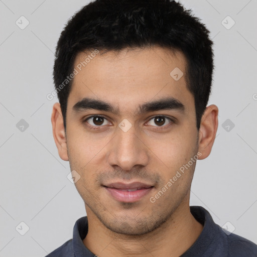 Joyful white young-adult male with short  black hair and brown eyes