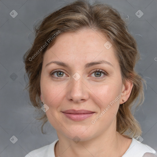 Joyful white adult female with medium  brown hair and grey eyes