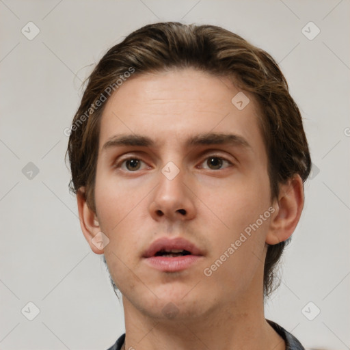 Neutral white young-adult male with short  brown hair and brown eyes