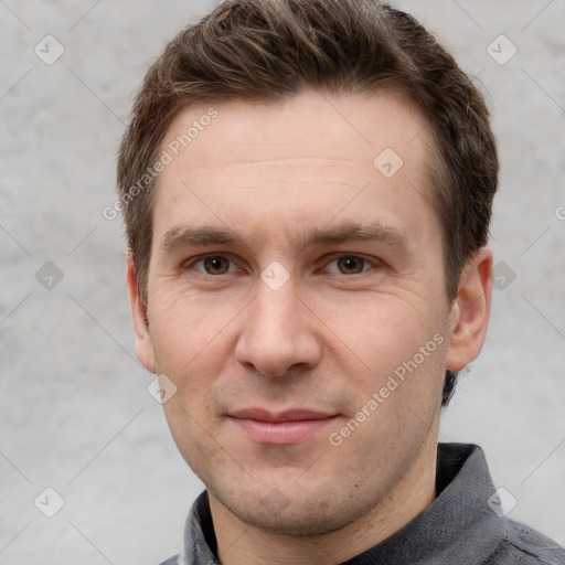 Joyful white adult male with short  brown hair and grey eyes