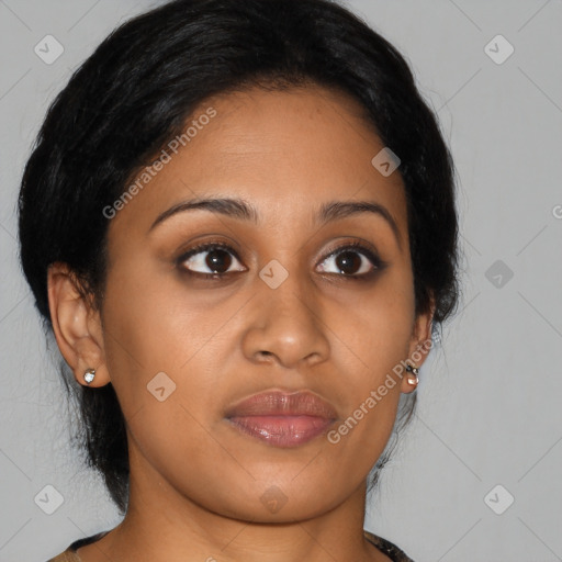 Joyful latino young-adult female with medium  brown hair and brown eyes