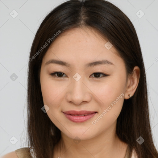 Joyful asian young-adult female with long  brown hair and brown eyes