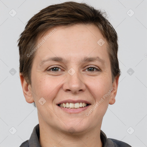 Joyful white adult female with short  brown hair and grey eyes