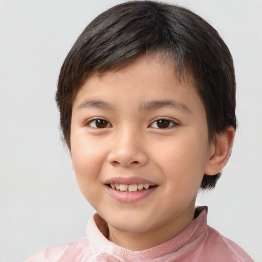 Joyful white child female with short  brown hair and brown eyes
