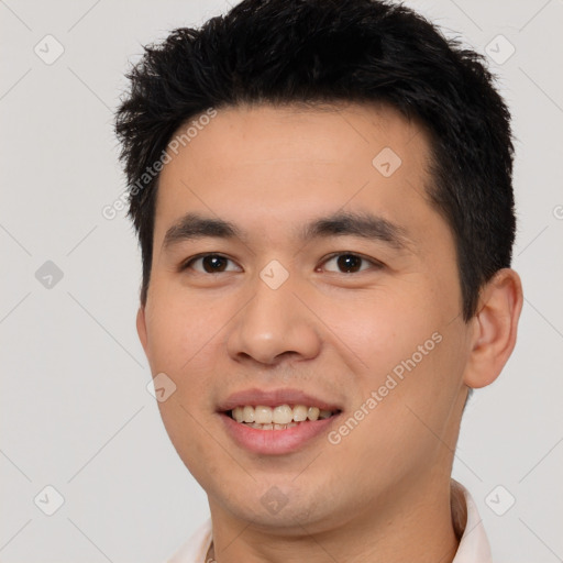 Joyful white young-adult male with short  black hair and brown eyes