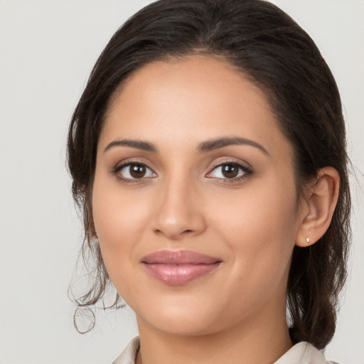 Joyful white young-adult female with medium  brown hair and brown eyes