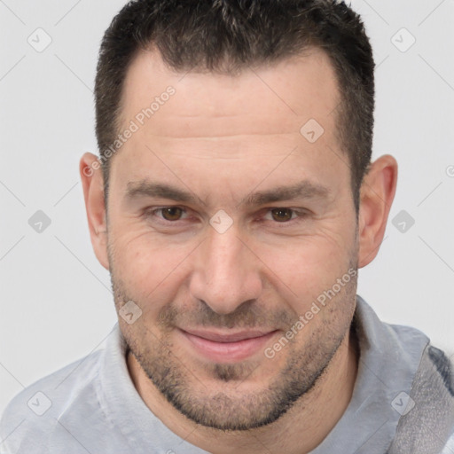 Joyful white adult male with short  brown hair and brown eyes