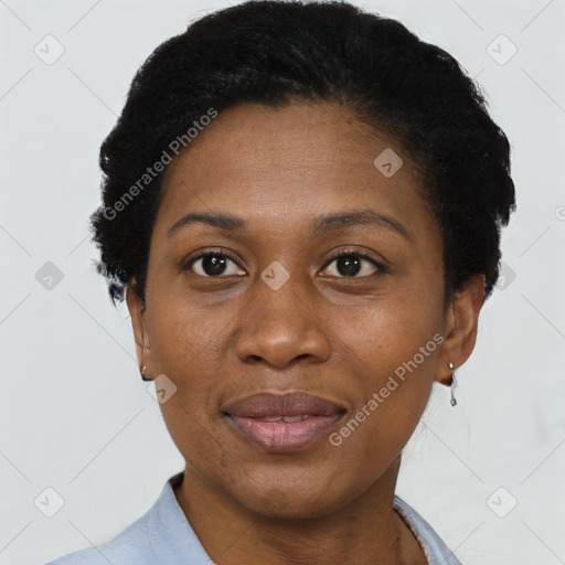 Joyful black adult female with short  black hair and brown eyes