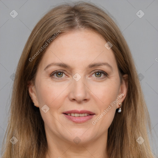 Joyful white adult female with long  brown hair and grey eyes