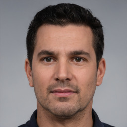 Neutral white young-adult male with short  black hair and brown eyes