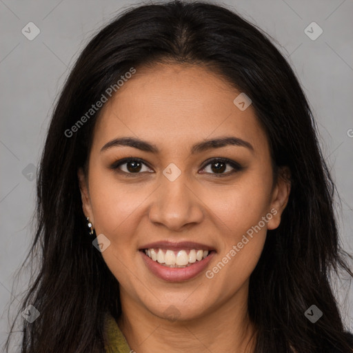 Joyful latino young-adult female with long  brown hair and brown eyes