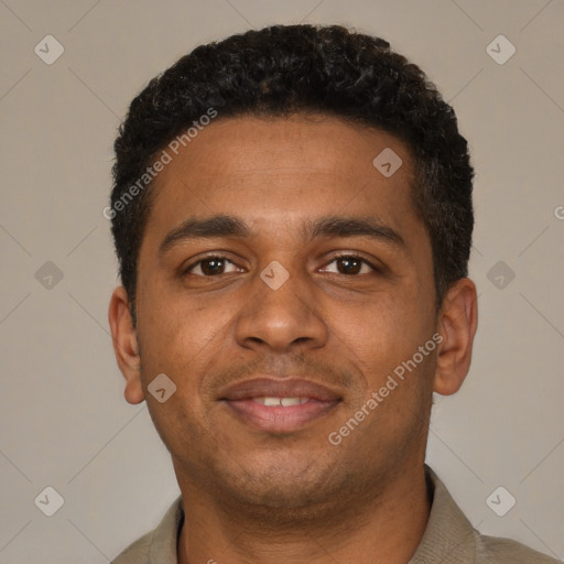 Joyful black young-adult male with short  black hair and brown eyes