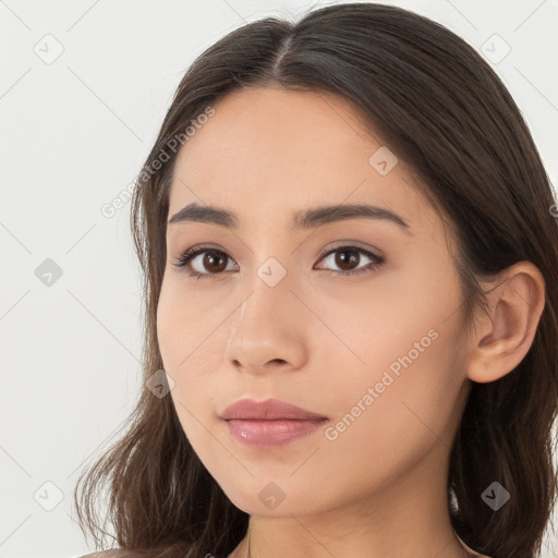 Neutral white young-adult female with long  brown hair and brown eyes