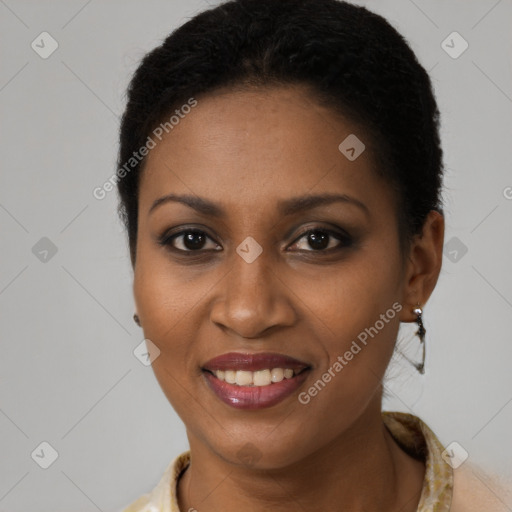 Joyful black young-adult female with short  brown hair and brown eyes