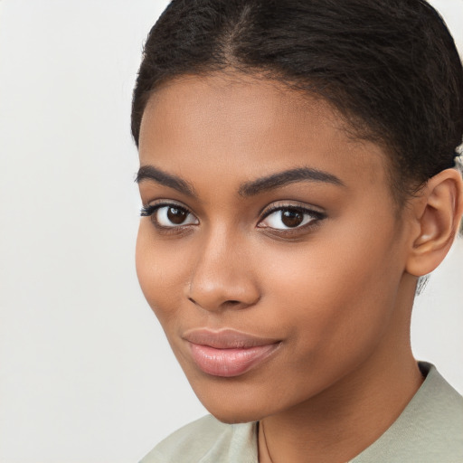 Joyful latino young-adult female with short  brown hair and brown eyes