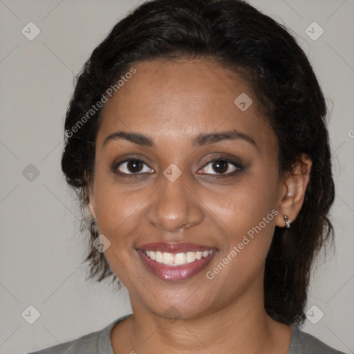 Joyful black young-adult female with medium  brown hair and brown eyes