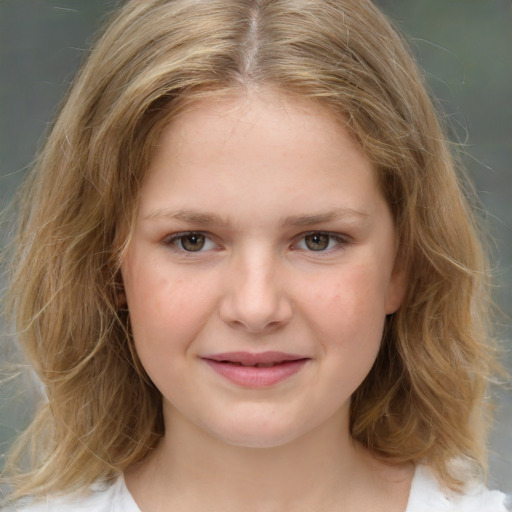 Joyful white child female with medium  brown hair and grey eyes