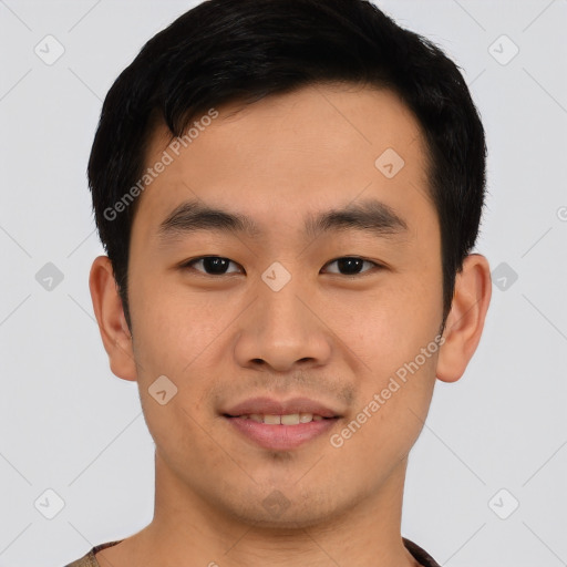 Joyful asian young-adult male with short  black hair and brown eyes