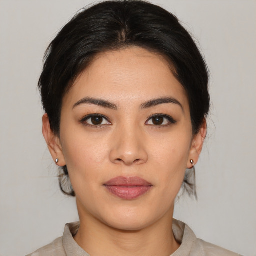 Joyful asian young-adult female with medium  brown hair and brown eyes