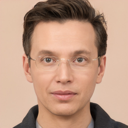 Joyful white adult male with short  brown hair and brown eyes