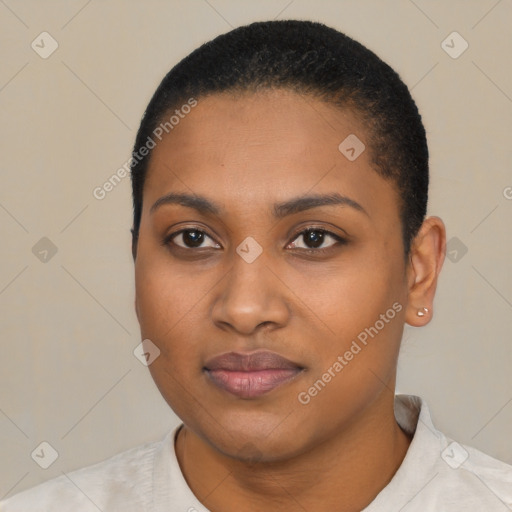 Joyful black young-adult female with short  black hair and brown eyes