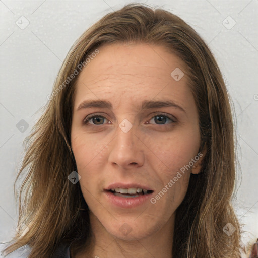 Joyful white young-adult female with long  brown hair and brown eyes