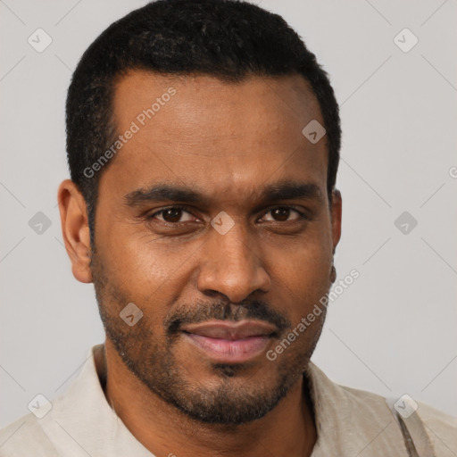 Joyful black young-adult male with short  brown hair and brown eyes