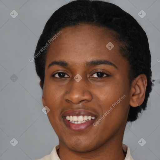 Joyful black young-adult female with short  black hair and brown eyes