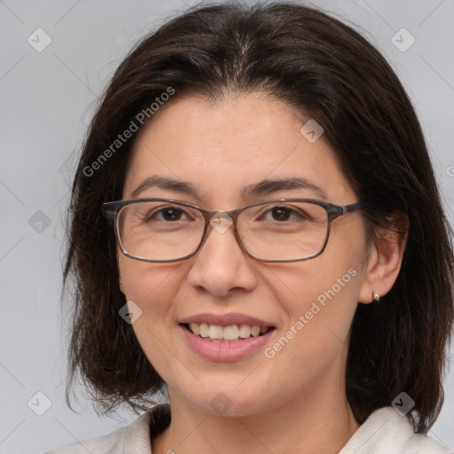 Joyful white adult female with medium  brown hair and brown eyes