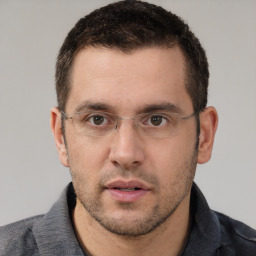 Neutral white young-adult male with short  brown hair and brown eyes
