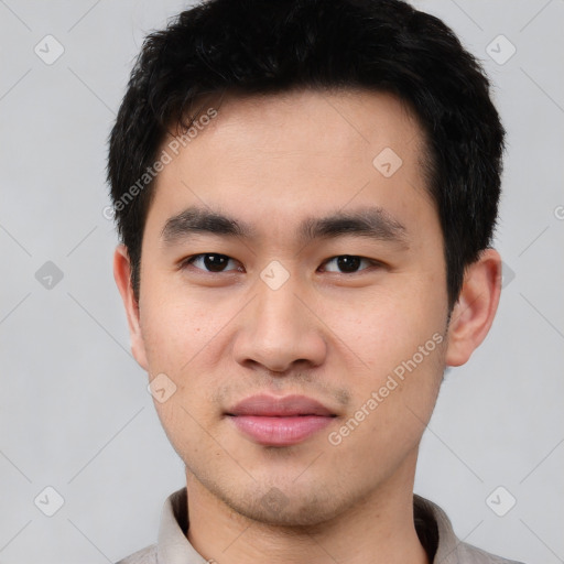 Joyful white young-adult male with short  black hair and brown eyes