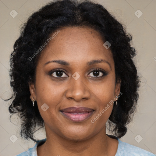 Joyful black adult female with medium  brown hair and brown eyes