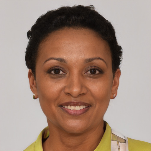 Joyful latino adult female with short  brown hair and brown eyes