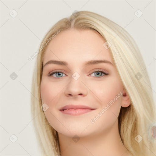 Joyful white young-adult female with long  brown hair and blue eyes