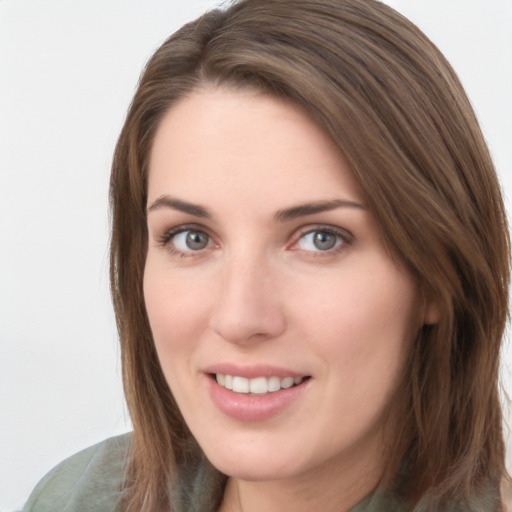 Joyful white young-adult female with long  brown hair and grey eyes