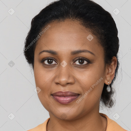 Joyful black young-adult female with medium  brown hair and brown eyes