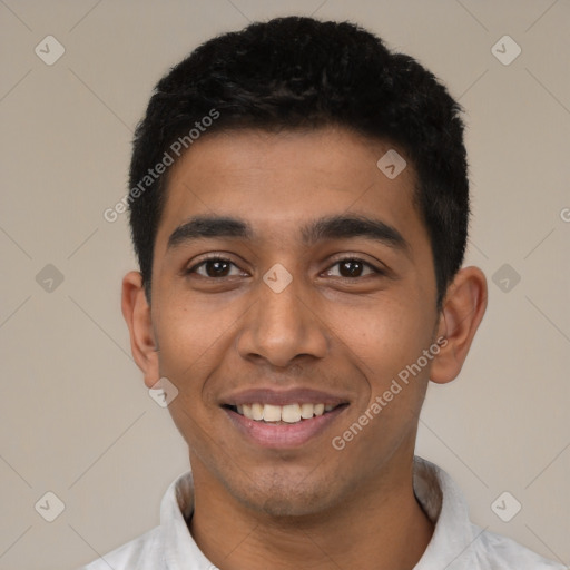 Joyful latino young-adult male with short  black hair and brown eyes