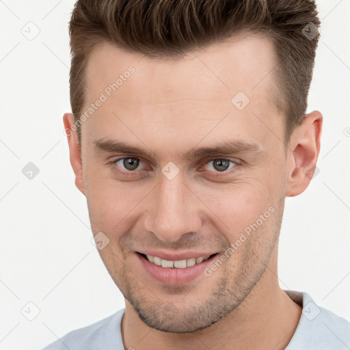 Joyful white young-adult male with short  brown hair and brown eyes