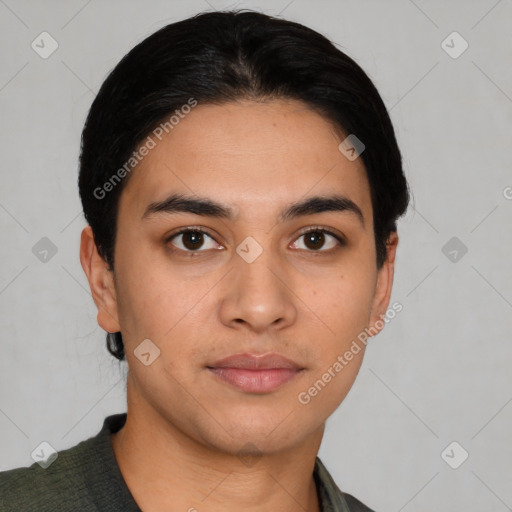 Neutral latino young-adult male with short  brown hair and brown eyes