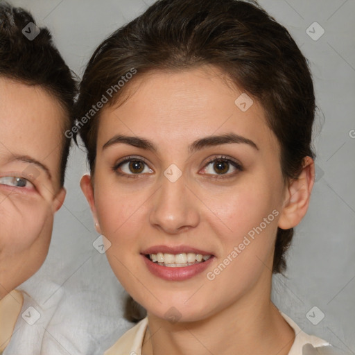 Joyful white young-adult female with medium  brown hair and brown eyes