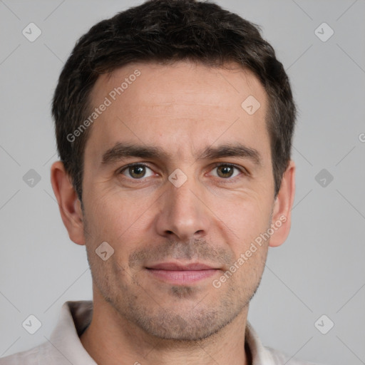 Joyful white adult male with short  brown hair and brown eyes