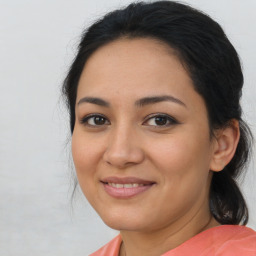 Joyful latino young-adult female with medium  brown hair and brown eyes