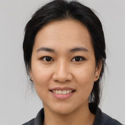 Joyful asian young-adult female with medium  black hair and brown eyes