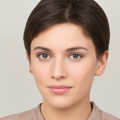 Neutral white young-adult female with short  brown hair and brown eyes