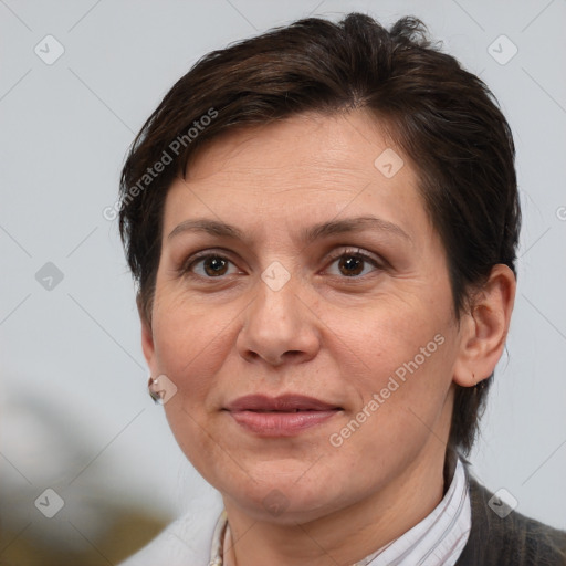 Joyful white adult female with short  brown hair and brown eyes