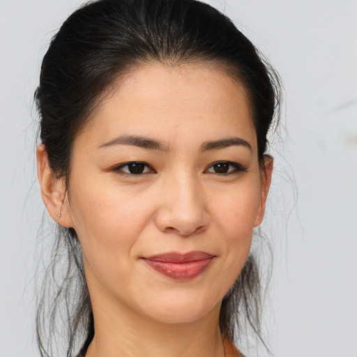 Joyful asian young-adult female with medium  brown hair and brown eyes